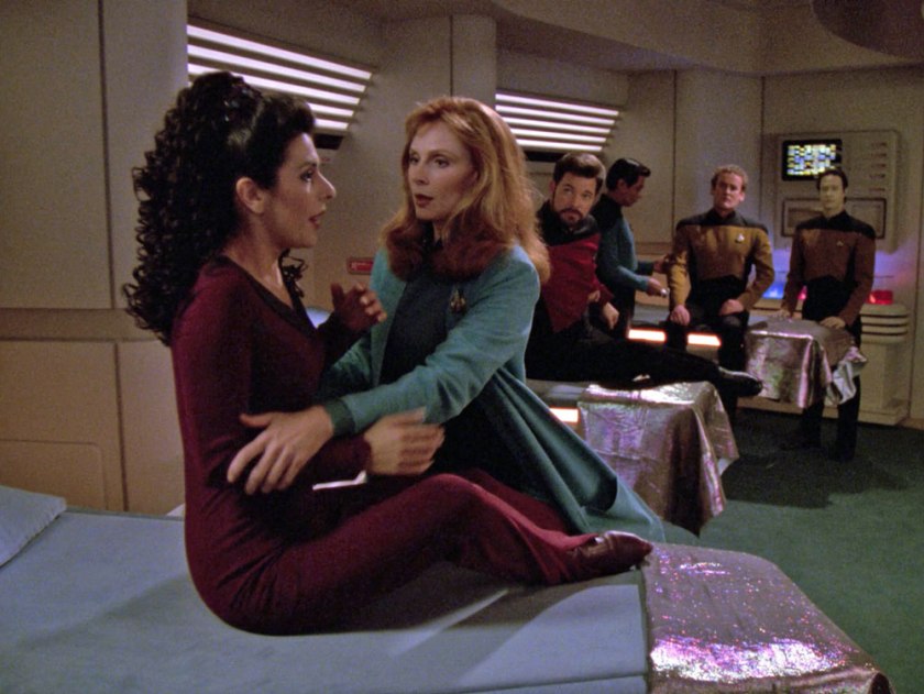 Troi, Riker, and O'Brien are sitting up on the beds in sickbay. That's most of the action.