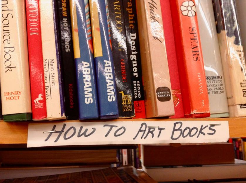 Used bookstore shelf labelled 'How To Art Books'