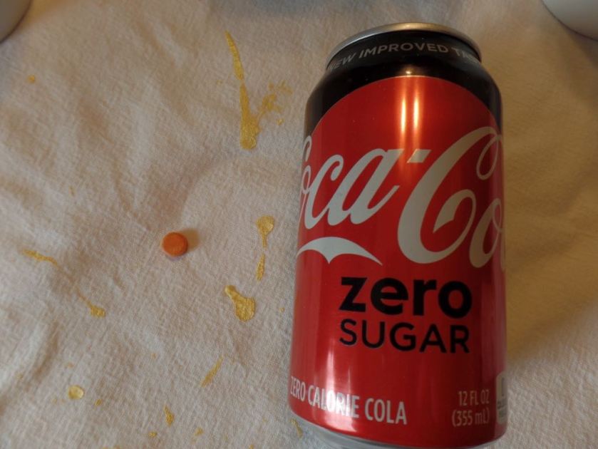 First, orange-looking dye tablet from the regular color packet. I finally thought to put it on the better-lit side of the Coke Zero can.