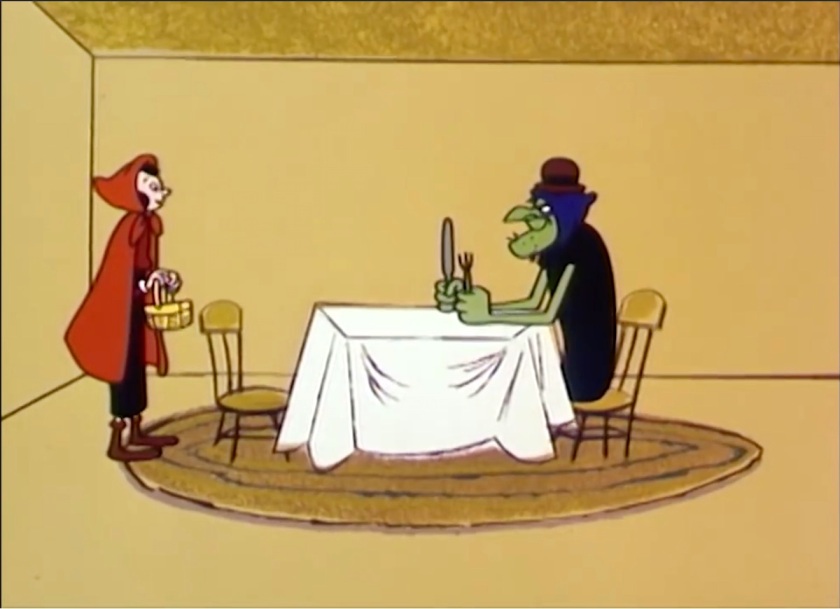 Olive Oyl, dressed as Little Red Riding Hood, stands before a dining table. Seated at it is the Sea Hag, wearing Wimpy's hat, and holding up knife and fork.