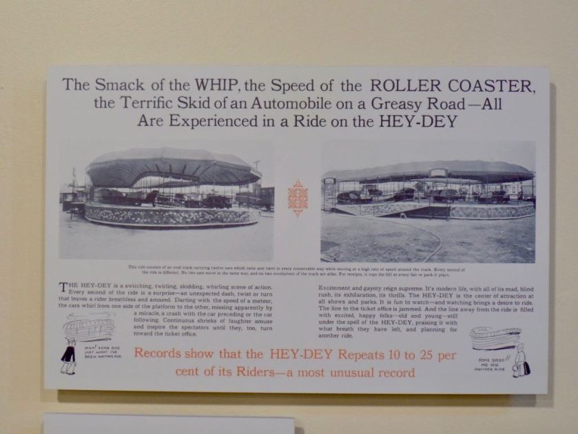 Reproduction of a vintage amusement-park-ride catalogue proclaiming 'The Smack of the WHIP, the Speed of the ROLLER COASTER, the Terrific Skid of an Automobile on a Greasy Road --- All Are Experienced in a Ride on the HEY-DEY', and showing two pictures of the installed ride where it's not clear what the ride actually does. But 'Records show that the HEY-DEY Repeats 10 to 25 per cent of its Riders --- a most unusual record'.