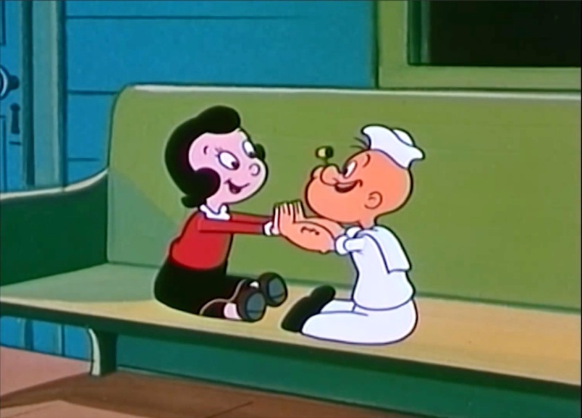 Olive Oyl and Popeye, both toddlers, sit on the porch playing patty-cake.
