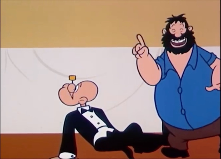 Popeye sprawled on the floor, looking behind him at an empty table. Brutus is photobombing, holding up one finger on an arm he sways back and forth while singing.