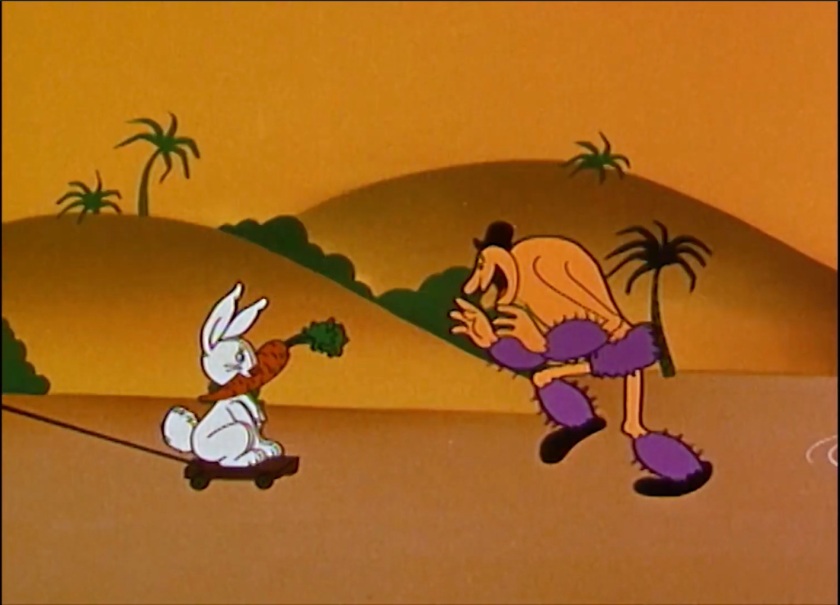 Someone off-screen pulls by a leash a decoy rabbit, holding a carrot in its mouth. An enthusiastic, happy Goon chases the decoy.