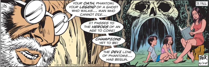 Mozz, foretelling: 'Your *oath*, Phantom! Your *legend* of a ghost who walks ... man who cannot die ... it passes to the *heroes* of an age to come! *Champions* yet to be! The *Devi* line of Phantoms ... has begun!' And we see Savarna reading, apparently recounting the legend of The Phantom, to two kids outside the Skull Cave. It's a scene very reminiscent of many images of Kit and Diana Walker raising Kit Junior and Heloise.